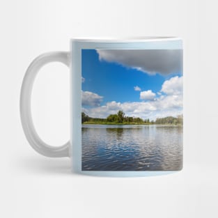 Blue cloudy summer sky over Bug river, Poland, Europe Mug